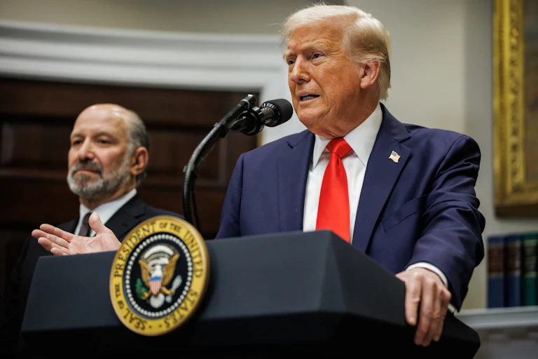 Donald Trump at a press conference with Howard Lutnick.