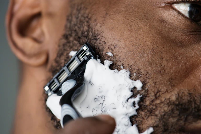 A man shaving his beard