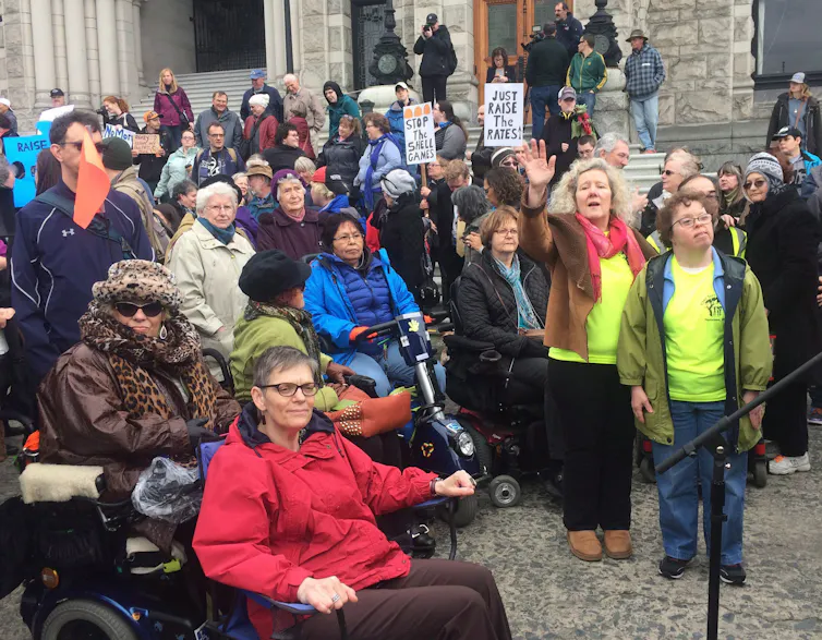 People protest on steps.