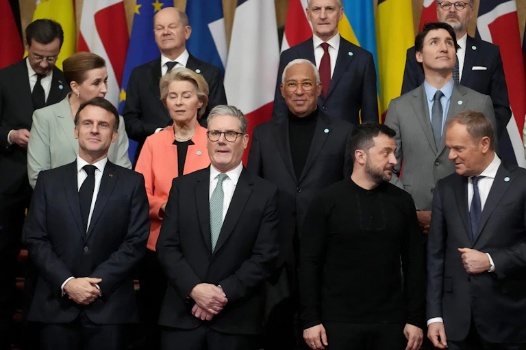 European leaders photographed before an official portrait is taken. Starmer, Macron, Zelensky and Scholz are in the front row.