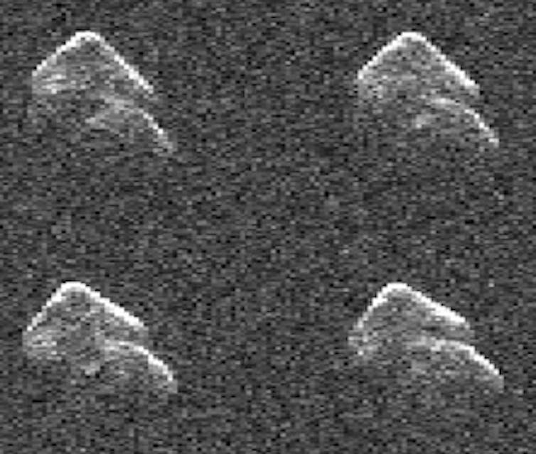 four semi-spherical objects against a grainy grey background