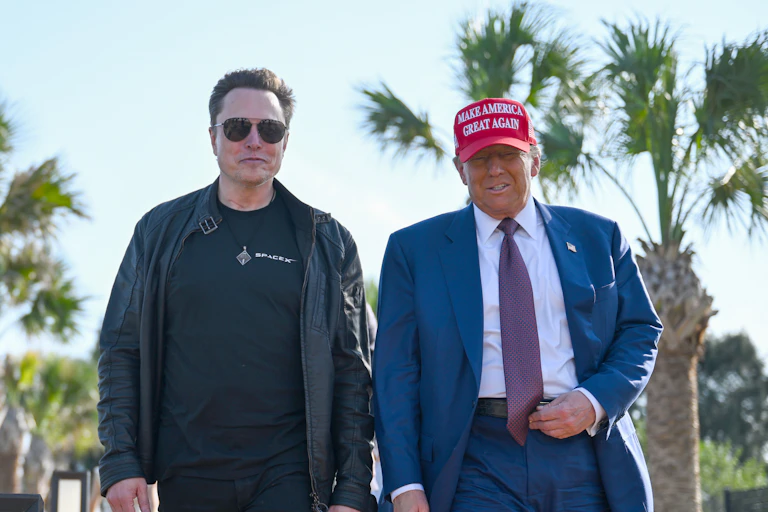 Elon Musk and Donald Trump walking together