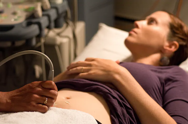 Pregnant woman having ultrasound