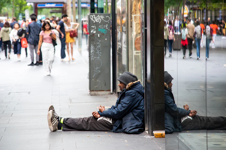 Homeless man on city street