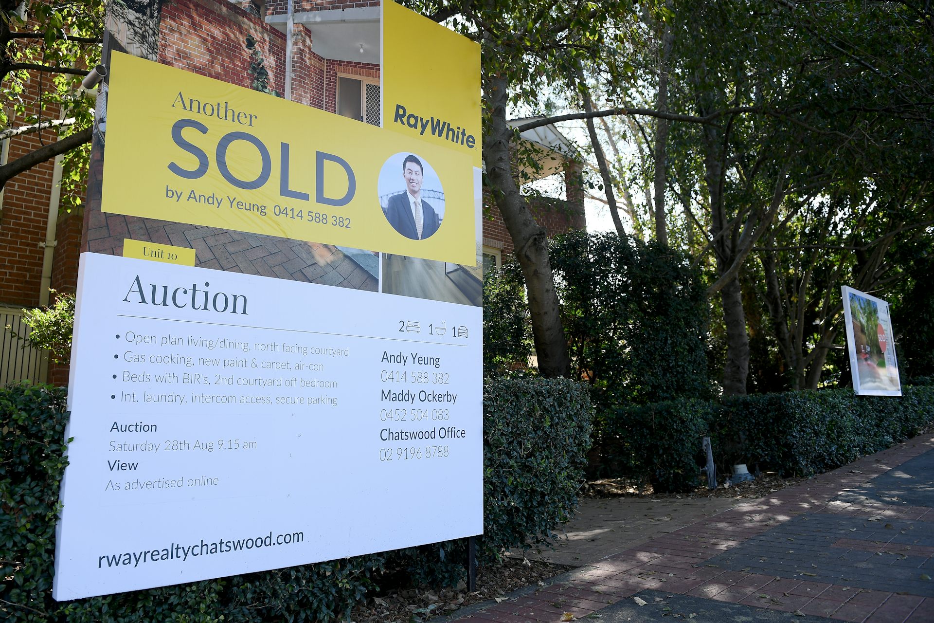 Auction sold sign outside house