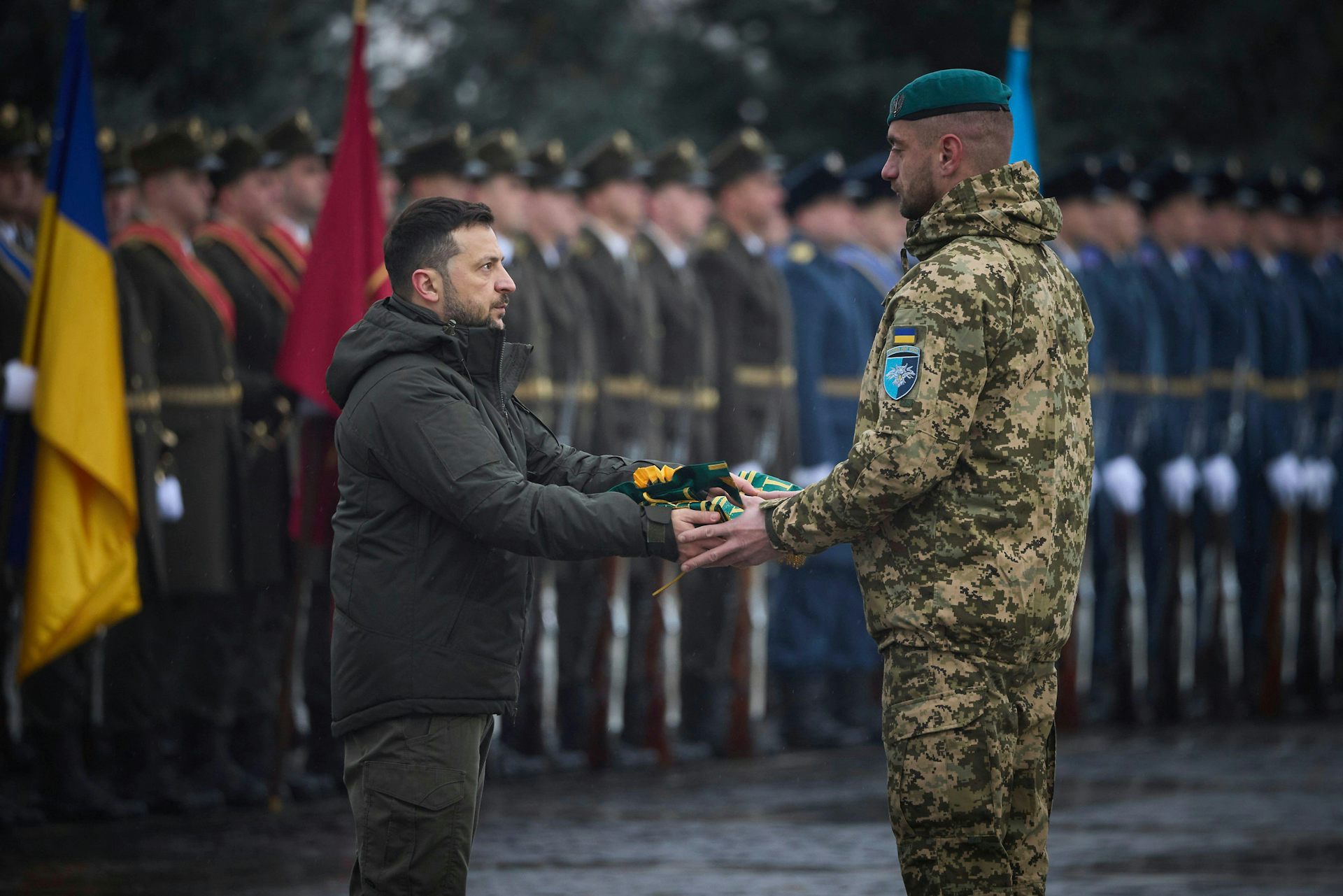 Volodymyr Zelensky hands a medal to a Ukrainian soldier during a ceremony in Kyiv, December 2024.