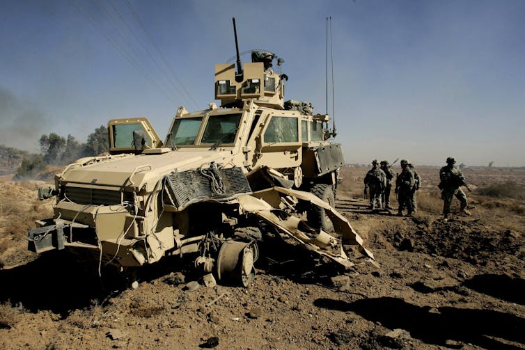 A heavily damaged military vehicle.