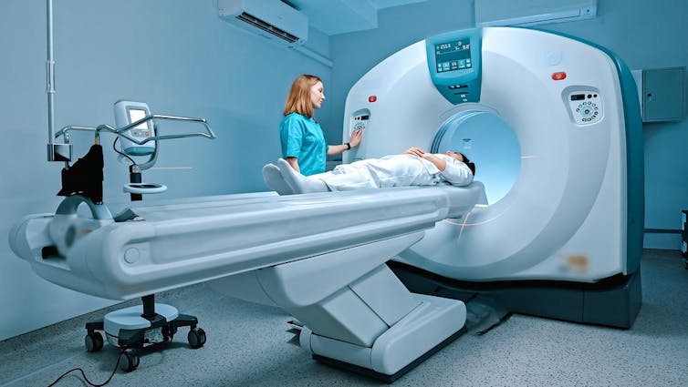 Person entering an MRI machine.