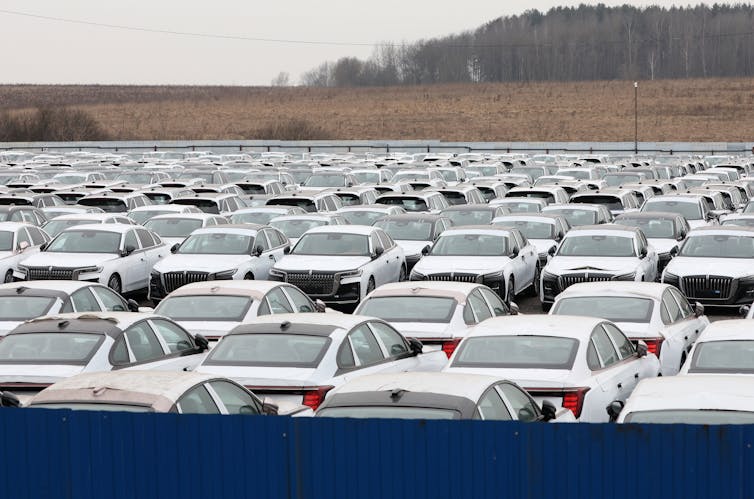 Russia’s financial system is stagnating – however that gained’t drive it to finish the struggle 1 Chinese cars parked at a dealership outside Moscow.