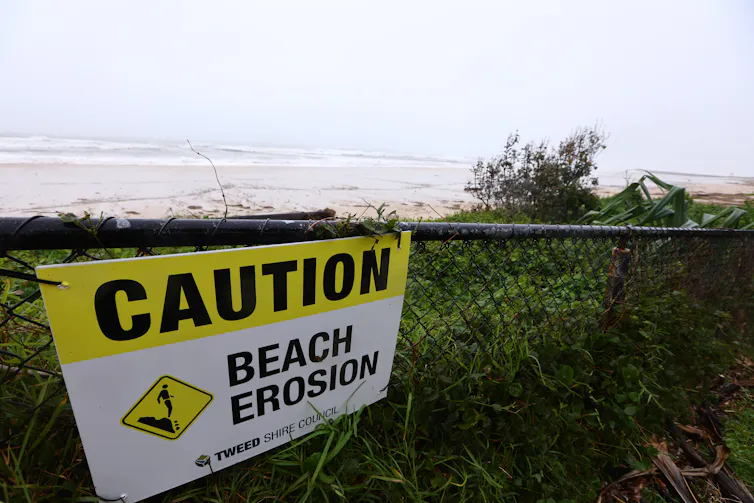 sign at beach saying 'beach erosion'