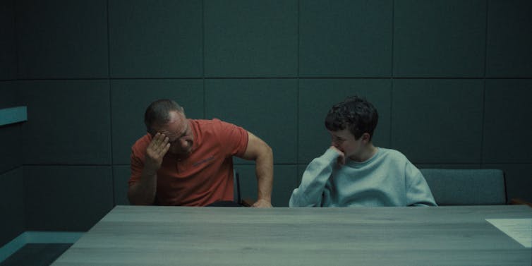 Stephen Graham and Owen Cooper sat in an interrogation room