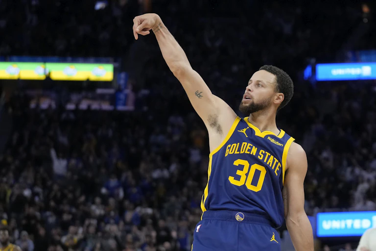 Steph Curry launches a three-point shot