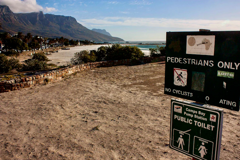 A beach with sea and mountain in the distance