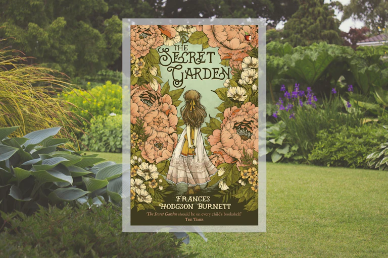 The cover of The Secret Garden on a backdrop of an English garden