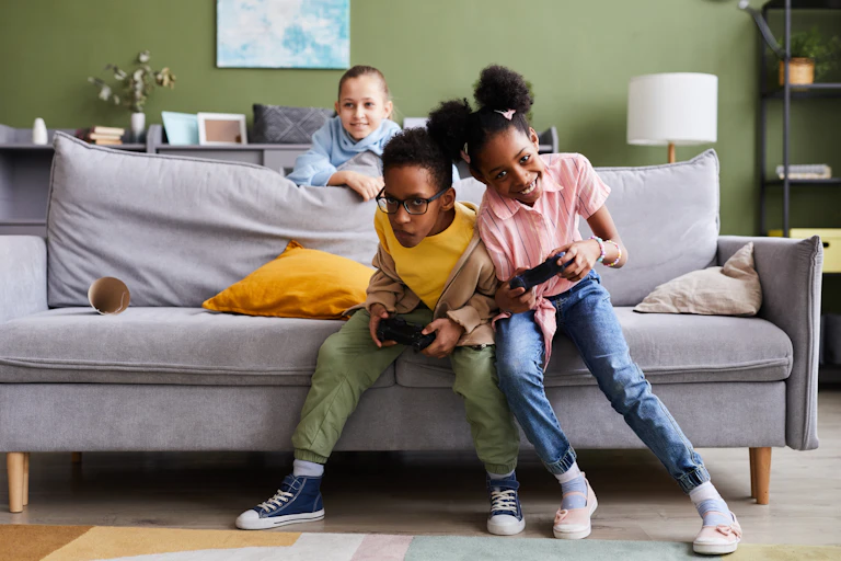 Children playing video games with consoles