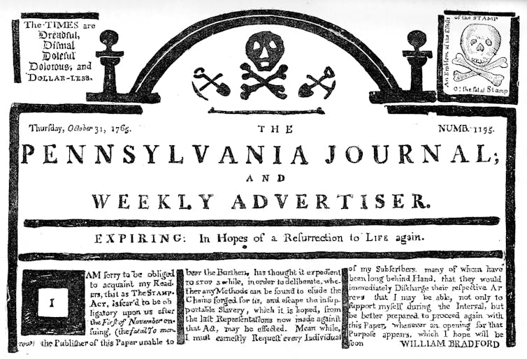 The top of an antique newspaper's front page.