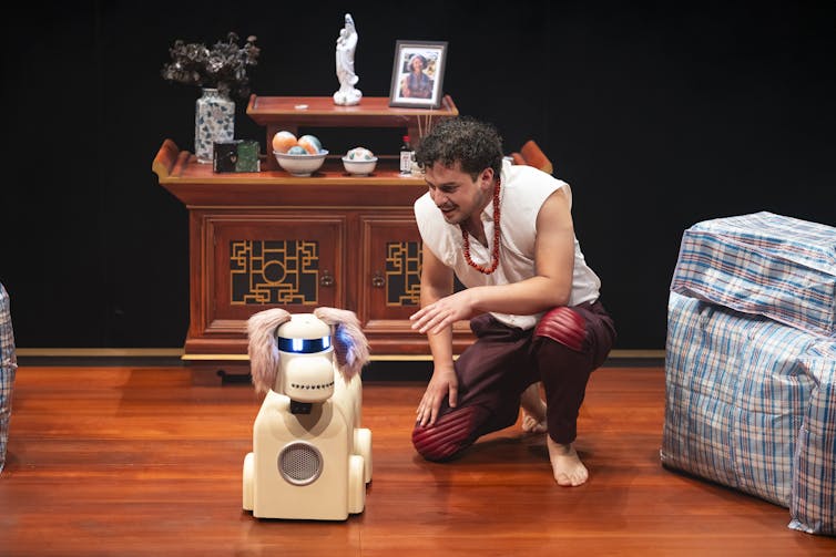 Production image: a man and a robot dog.