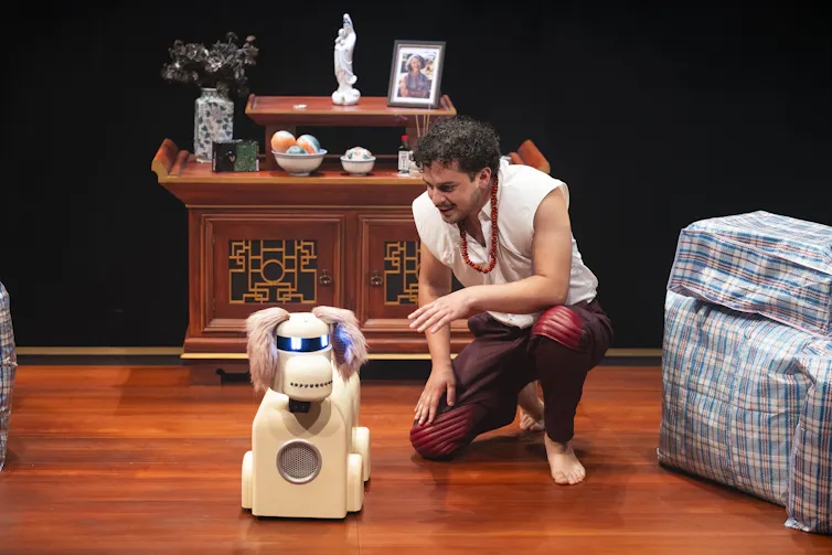 Production image: a man and a robot dog.