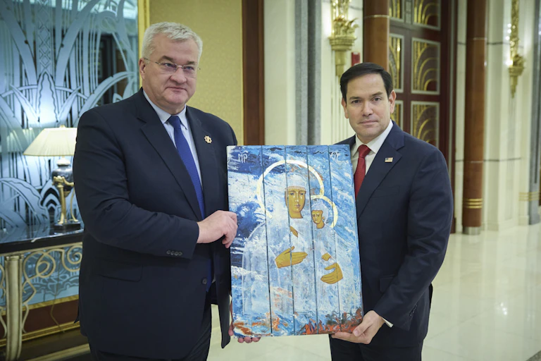 Ukrainian foreign minister Andrii Sybiha presents US secretary of state Marco Rubio with a religious icon painted on the lid of an ammunition box.