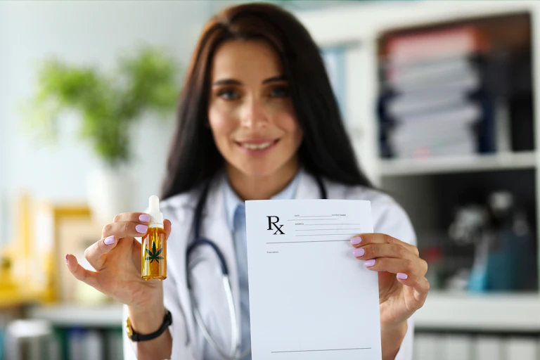 Doctor offers viewer a bottle of CBD oil in one hand and a prescription in the other