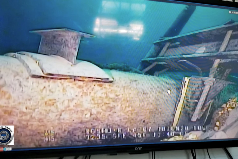 An underwater view of a large pipeline.