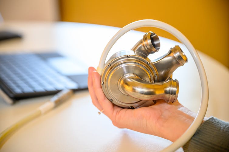 Hand holding the BiVACOR artificial heart