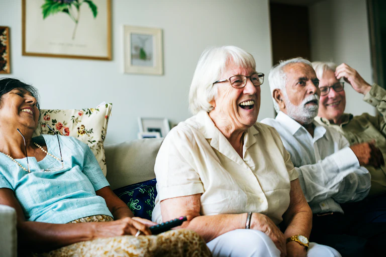 A group of senior people with animated expressions.