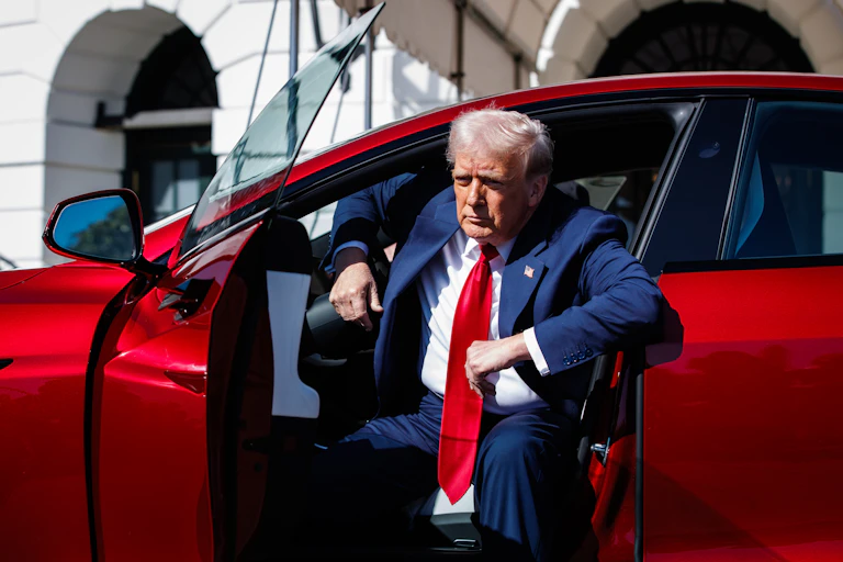 Donald Trump getting out of a red Tesla Model S on the South Lawn of the White House in Washington, D.C., USA, 11 March 2025.
