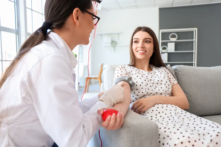 Young woman donating blood