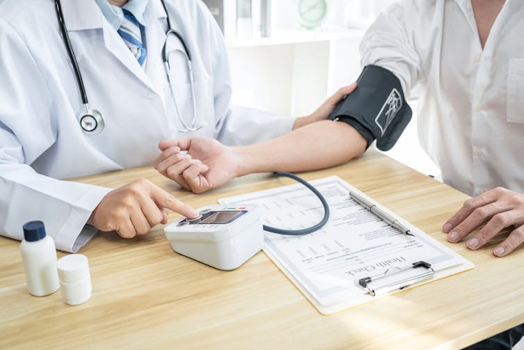 Person having their blood pressure taken.
