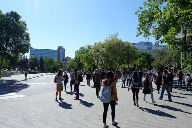 University students walking across campus.