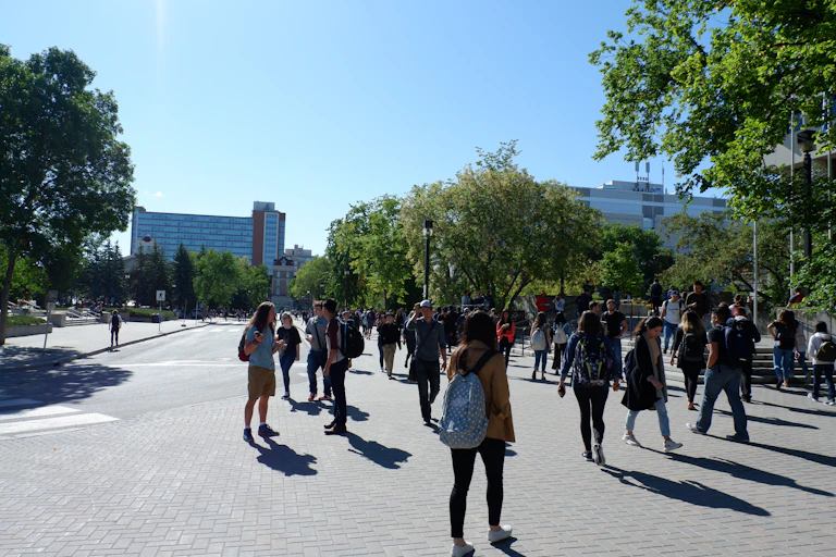 University students walking across campus.