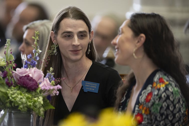 two women speaking to each other