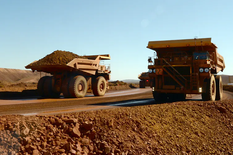 Haulage trucks at an iron ore mine in the pilbara