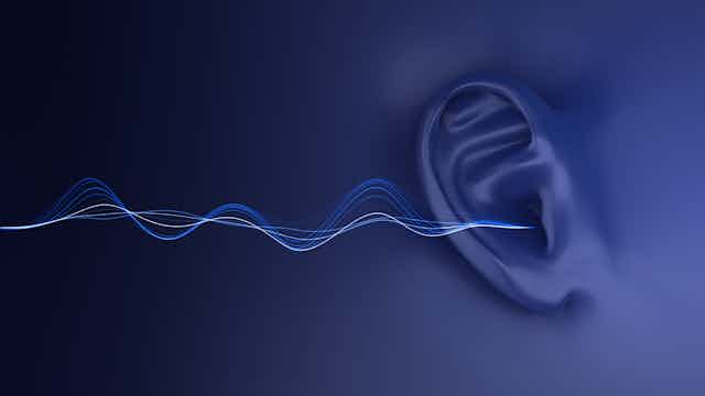Illustration of human ear with sound waves entering it