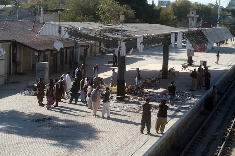 Who're the Baloch Liberation Military? Pakistan teach hijacking used to be fuelled through many years of forget and violence 2 Pakistani security officials inspect the scene of a suicide bomb blast at a railway station.