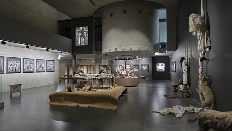 An art gallery with modern architecture holding art works, sculptures, installations.