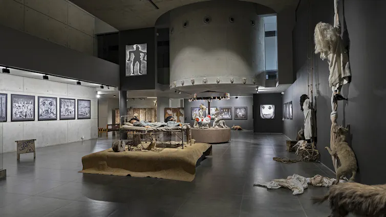An art gallery with modern architecture holding art works, sculptures, installations.