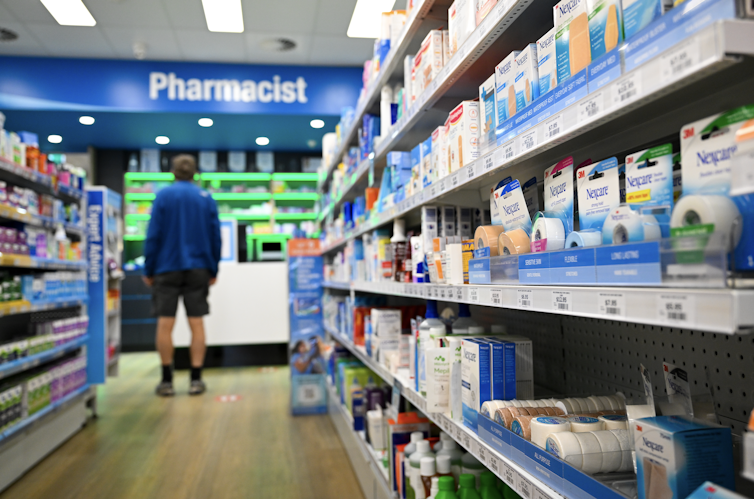 Man stands at pharmacy counter