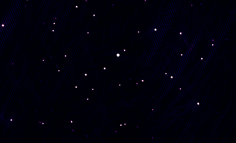 Photo showing dots of white on a black background.