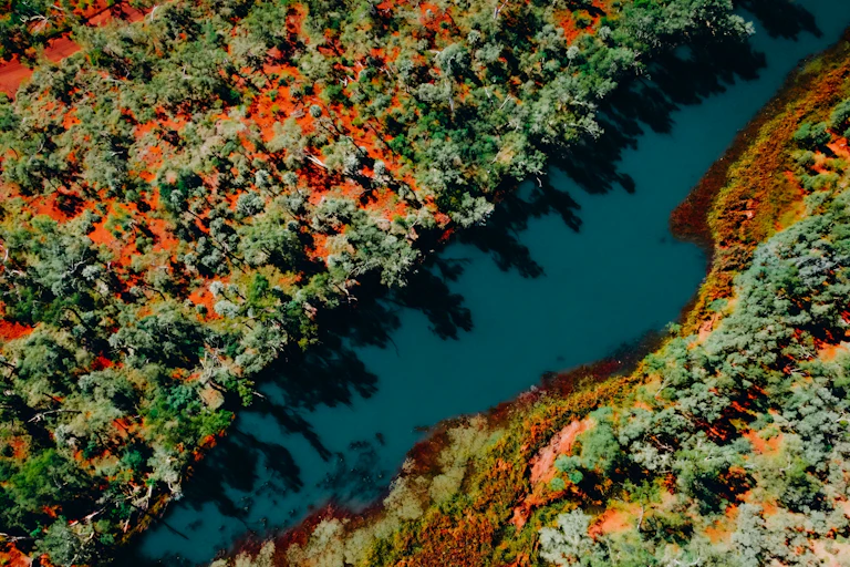 waterway and red dirt australia from above.