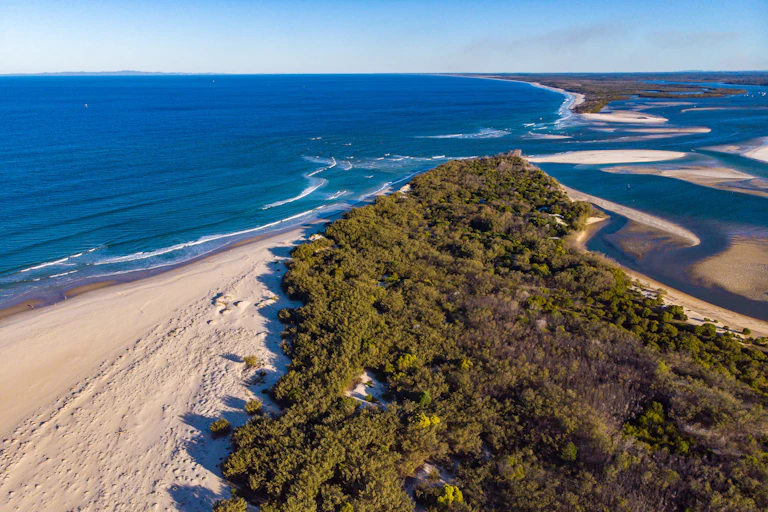 sandy island and ocean