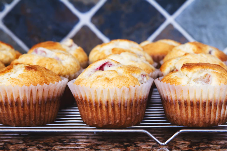 Close-up of a rack of rhubarb muffins.