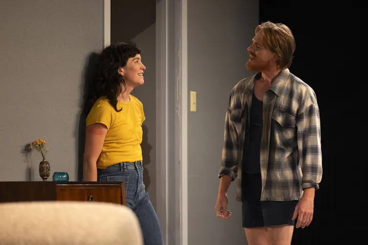 A man and a woman talk.