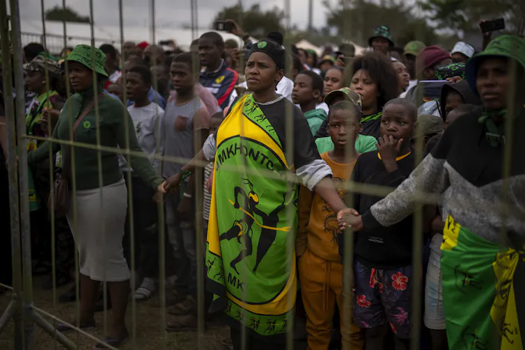 A crowd of people gathered at a political rally.