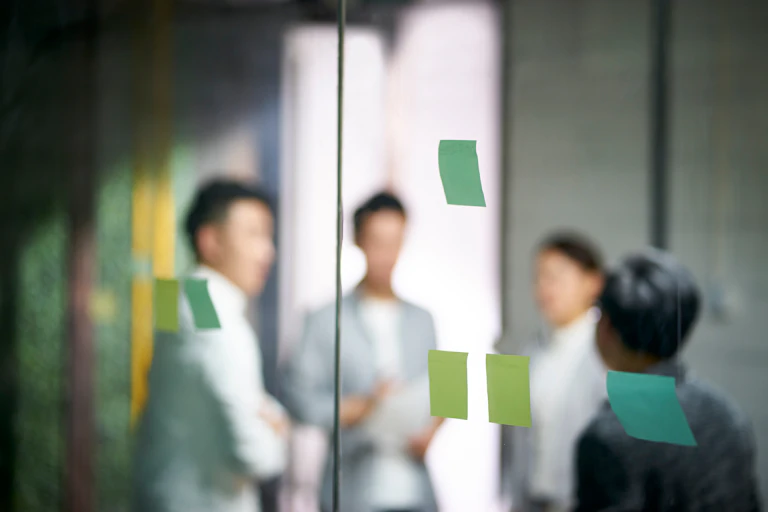 A group of people in a meeting room.