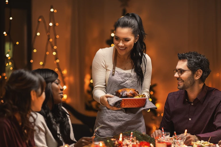 People gathered around a table to eat.