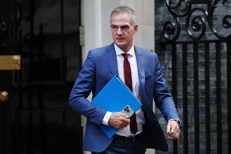 Peter Kyle departs 10 Downing Street carrying a blue folder