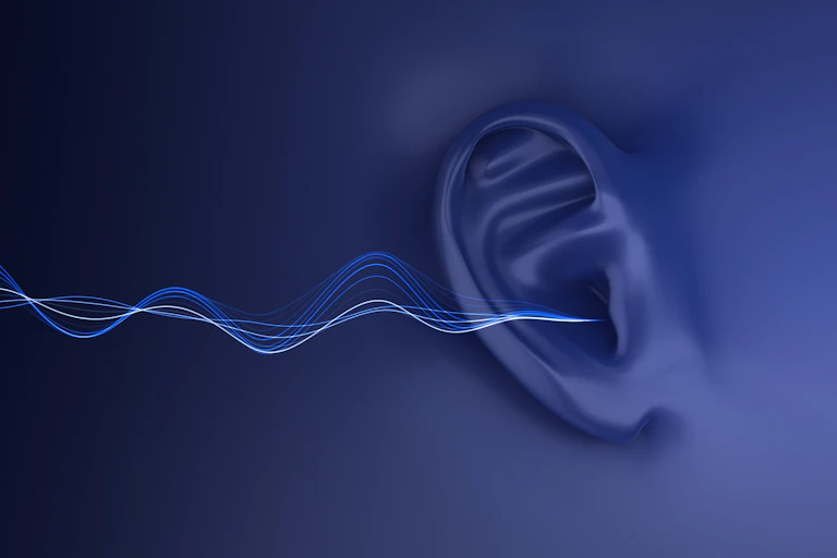 Ilustração de um ouvido humano com ondas sonoras entrando nele