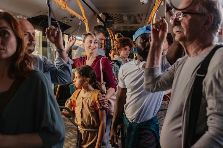 Photo of people on a crowded bus.